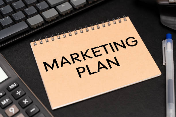 istock MARKETING PLAN text on Notebook with calculator and office supplies. Marketing Plan Business Advertising. 2197686916