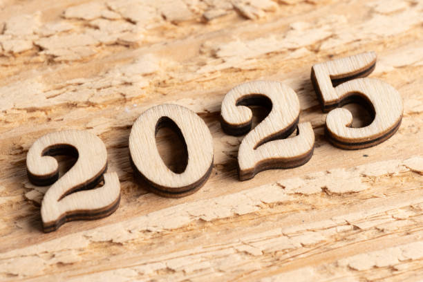 istock New year 2025 with wood numbers on rustic wooden background. 2197687482