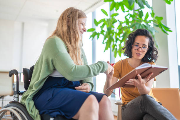 istock Smiling Diverse Businesswomen Discuss Notes In Modern Office 2197688454
