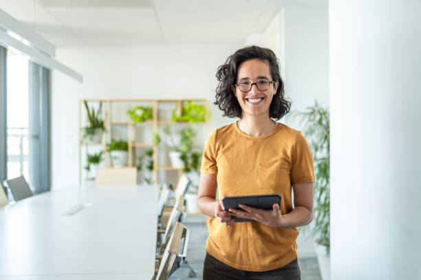 istock Cheerful Hispanic Businesswoman Using Digital Tablet In Office 2197688531