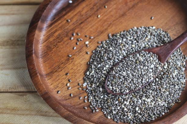 istock Chia seeds on brown wood background 2197692391