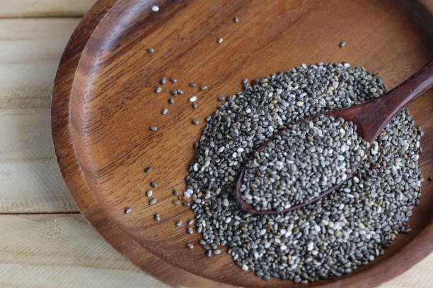 istock Chia seeds on brown wood background 2197692395