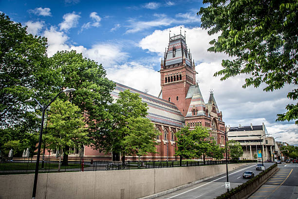 istock Historic university building surrounded by greenery on a sunny day 2197694644