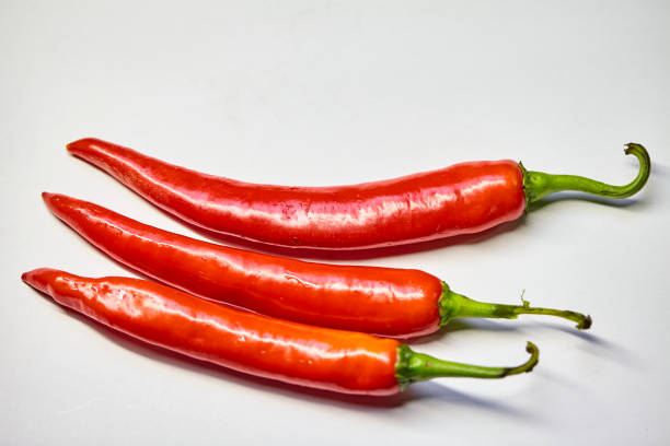 Bright Red dried red chillies are display on white background