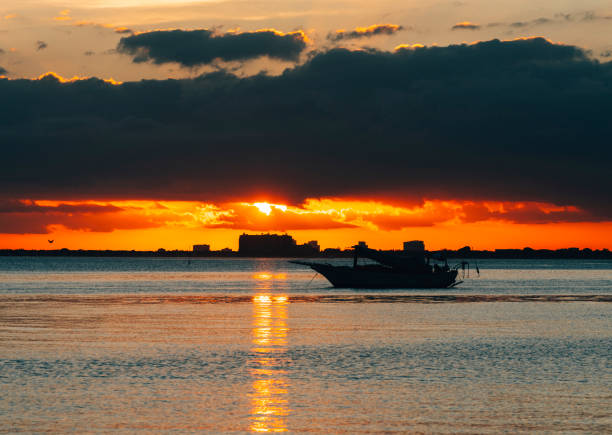 sunset over the sea boat life Florida in Miami, Florida, United States