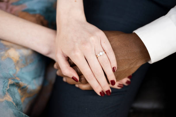 Engaged Couple Holding Hands: Interracial Love