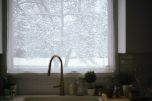 Snowy morning view from a kitchen window with a cozy ambiance