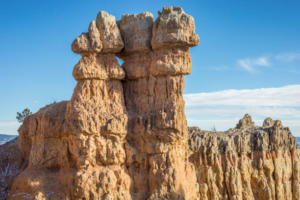 Capture the majesty of Bryce Canyon with this image of towering hoodoos against a vibrant blue sky.
