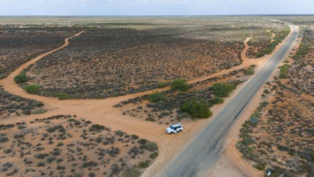istock Remote Desert Landscape with Lone Car 2197702779