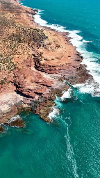 istock Aerial view of rugged coastline with turquoise waters. 2197702785