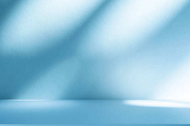 istock Studio style background wall decoration presentation uses white and blue tones. with shadows cast from a nearby window, concept creating a decorative 2197703262