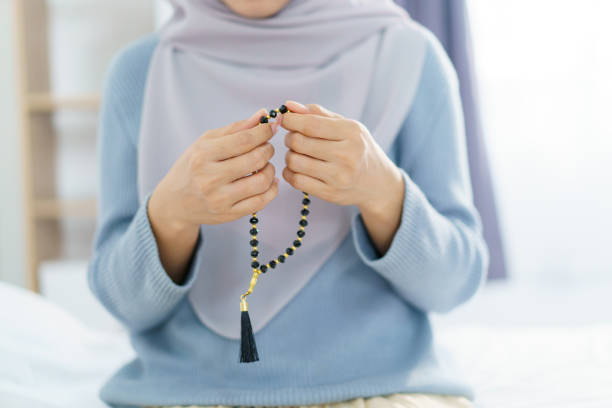 istock Asian muslim woman praying for Allah. 2197703978