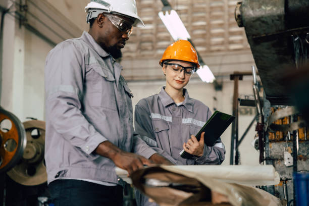 istock professional engineer worker team working for plant renovate with floorplan building talking 2197704323