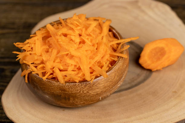 istock grated orange carrots on the table during cooking 2197705822