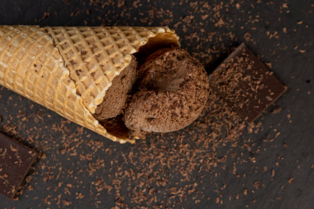 istock chocolate ice cream with chocolate chips on black slate 2197706432
