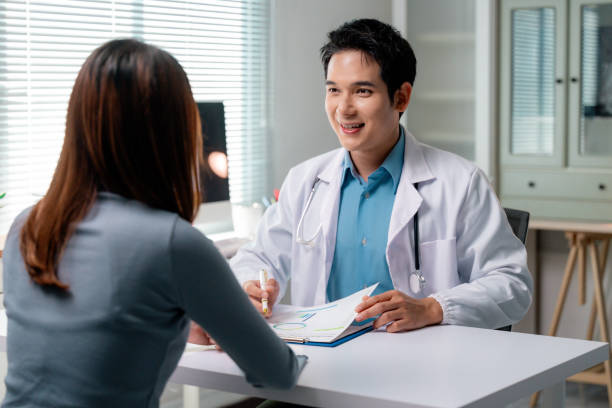 istock Doctor explaining diagnosis to patient during medical consultation 2197707554