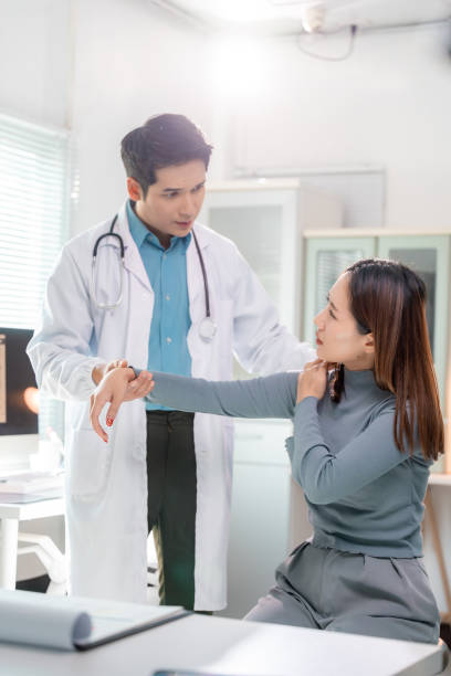 istock Doctor examining patient's arm in medical office 2197707620