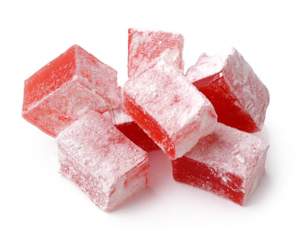 istock Red Turkish delight cubes dusted with powdered sugar arranged on a white surface 2197709822