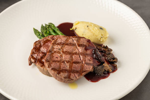istock Grilled beef steak with red wine sauce, mashed potatoes, and asparagus 2197711739