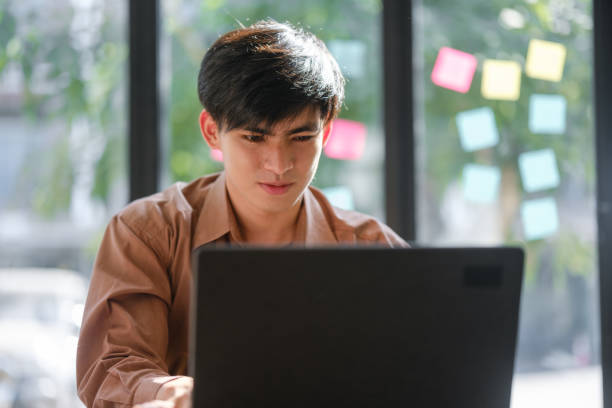 istock Businessman or student studying online, analyzing financial reports for strategic planning and learning. 2197712328