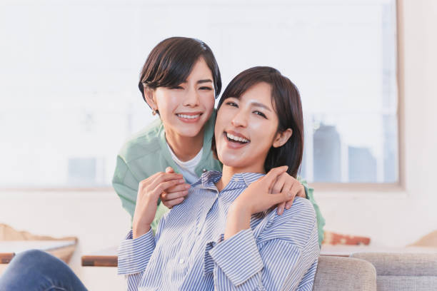 istock Affectionate female partners holding hands and having skinship indoors 2197713495
