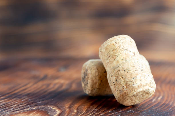 istock Two wine corks close-up on a wooden background 2197716138