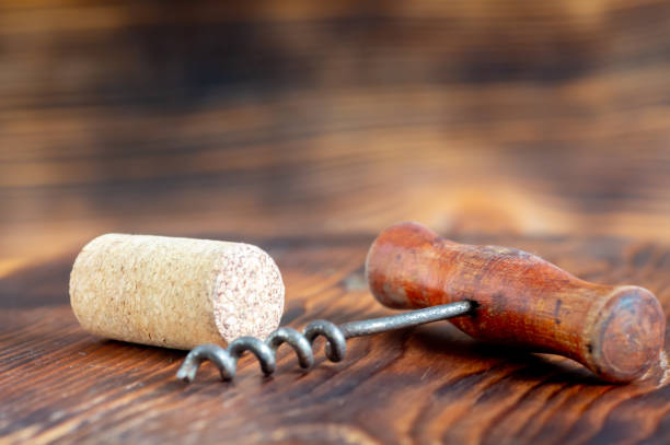 istock One cork, corkscrew on a wooden background 2197716139