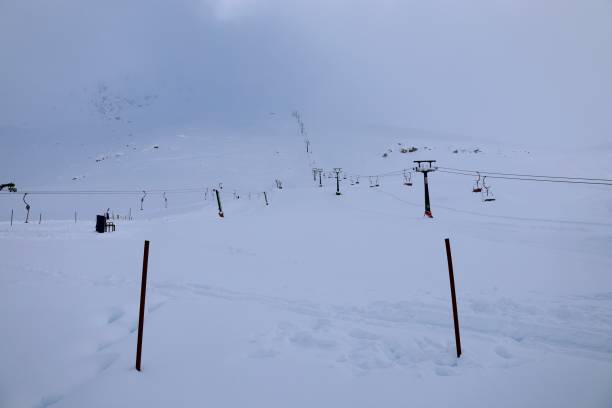 istock Snowy mountain ski-lift 2197716497