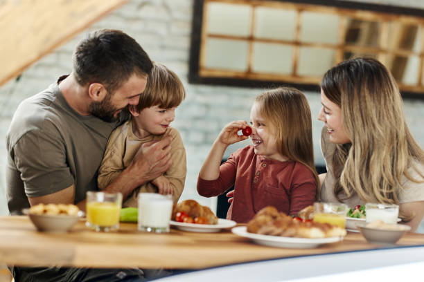 istock Happy family talking during a meal in dining room. 2197716588
