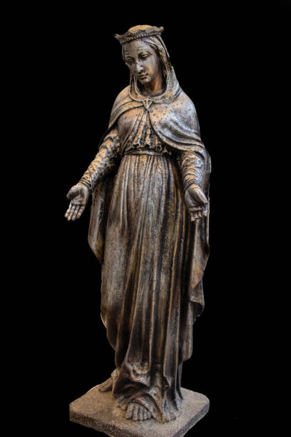 istock virgin mary statue, isolated on black background. 2197717600