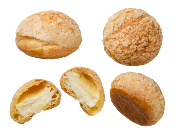 istock Set of cake eclairs shu close-up on a white. Isolated 2197718198