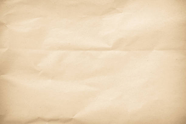 istock Old paper vintage texture surface for background. Recycle pale brown paper crumpled texture, Cream color recycled kraft paper texture blank with copy space for text. 2197720316