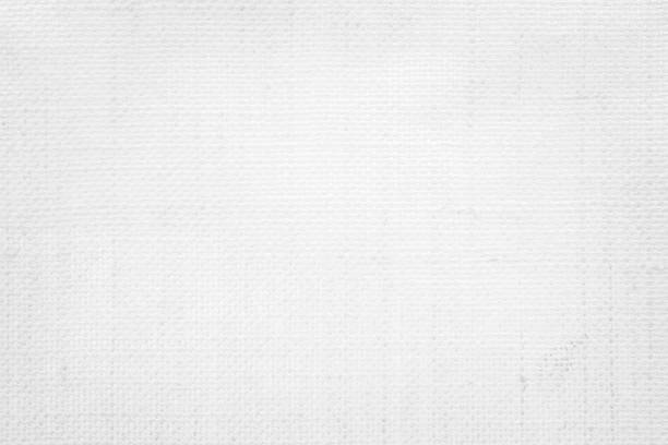 istock White color fabric canvas woven texture background in pattern light blank. Natural gauze linen, carpet wool and cotton cloth textile textured as clean empty for decoration text. Grey sack material. 2197720327
