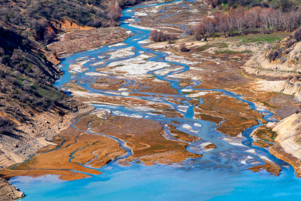 istock COLORED REFLECTIONSColorful reflections falling on lakes, seas, water. Shapes formed on water by colors such as red, yellow, green, purple, white. Usually in harbors, fishing shelters and forests. 2197722728