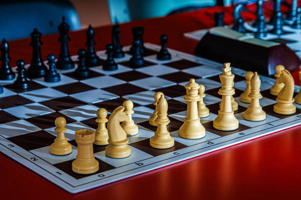 istock Closeup of a chessboard with pieces ready for play. Professional chess set arranged for a match, highlighting logic, tactics, and strategic thinking in a competitive and intellectual board game 2197725525