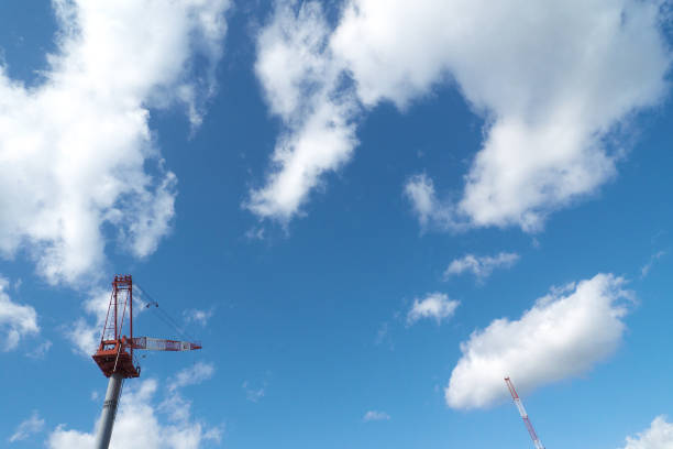 Construction tower cranes on a building site