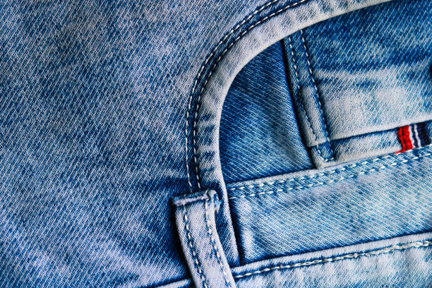 Jeans texture with seams. Denim background. Jeans texture.