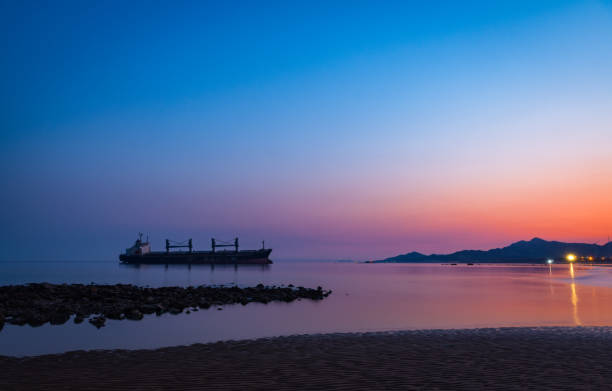 The ship on the vast sea in the dim morning light