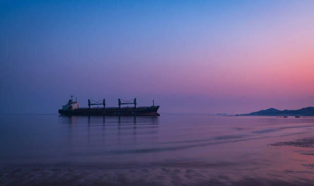 istock The ship on the vast sea in the dim morning light 2197731092