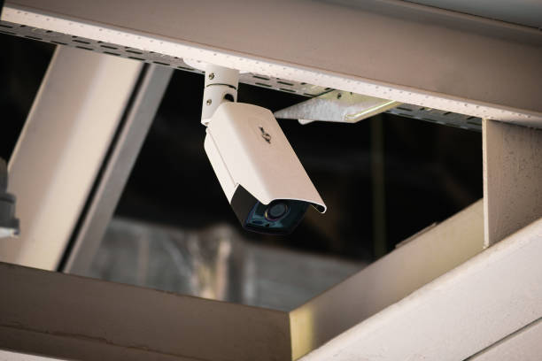 istock A security camera mounted on a metal beam under the ceiling of a large arena 2197732751