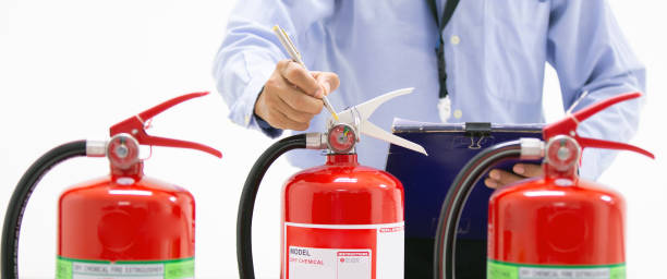 istock Fire protection engineering checking inspection services the red fire extinguishers tank in the building concepts of prevent emergency and safety rescue training. 2197732879