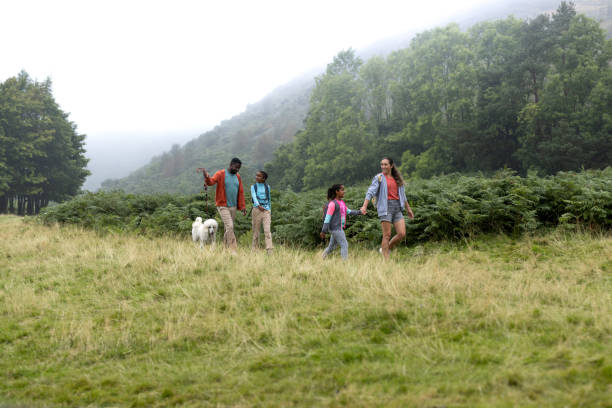 istock Parents and Children Enjoying a Scenic Nature Walk 2197733529