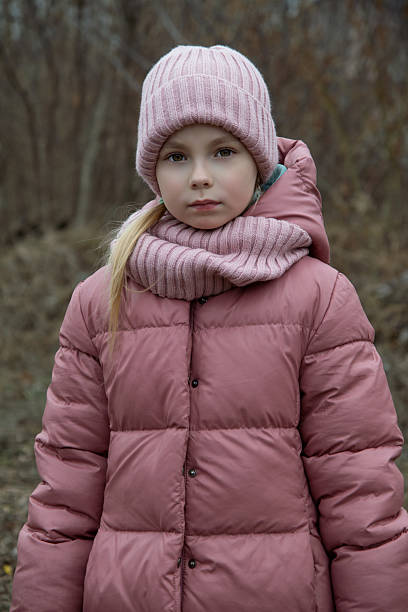 istock a girl walks in the forest 2197734019