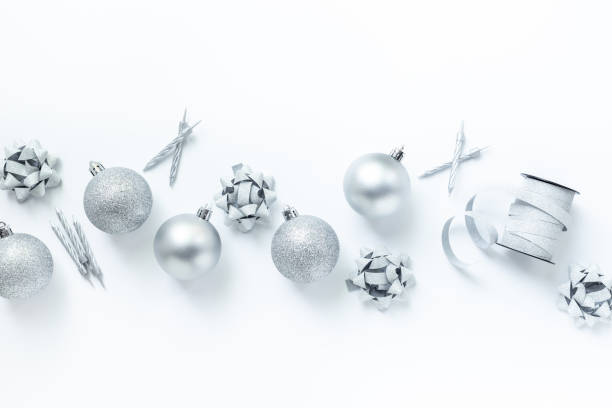 istock Silver colored Christmas and New Year decorations on white background, top view 2197734775