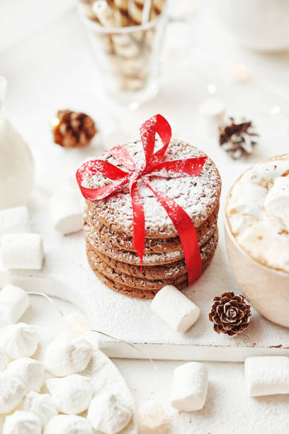 istock Christmas cake and sweets on table. Christmas decorations with lights background. Happy New Year! Christmas greeting card. Winter card template. Xmas concept. Holiday Banner. Feast of Nativity. 2197735136