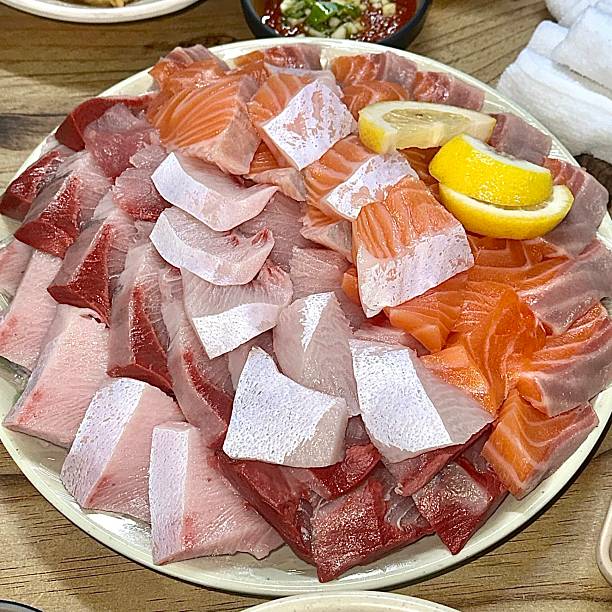 istock Sashimi, a Japanese delicacy featuring thinly sliced raw fish, served fresh and beautifully arranged for a pure and flavorful experience. 2197735444