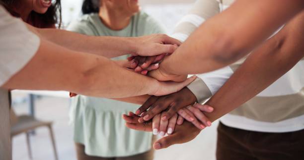 istock Office, business people and huddle with hands for motivation, team building and support for startup. Collaboration, employees and designers with stack for agreement, solidarity and goals by closeup 2197737973