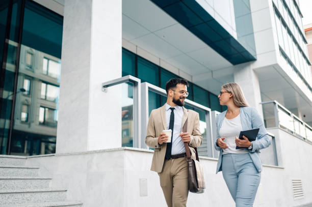 istock Business people walking outside office building having discussion 2197738654