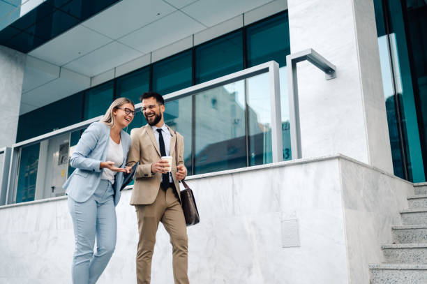 istock Business people walking outside office building having fun 2197738663