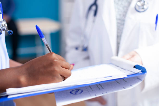 istock Nurse writing medical information 2197742086